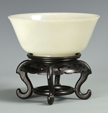 Bidding was heavy for a Qianlong white jade bowl measuring 6 5/8 inches diameter; it competed to $40,920. Case Antiques image