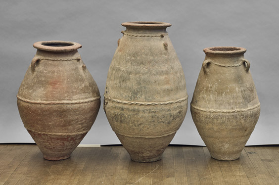 Lot 460 - Three large antique Omani transport pottery jars. The largest is 28 inches high. I.M. Chait image