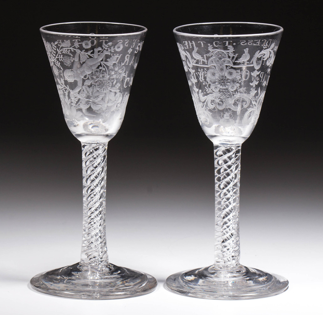 This pair of mid-18th century engraved English air-twist wine glasses sold for $10,925 to a buyer in the UK. Jeffrey S. Evans & Associates image
