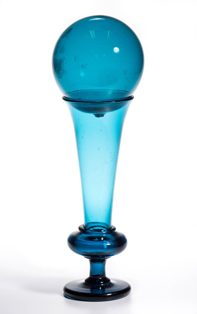 Possibly from the New England Glass Co., this brilliant peacock blue free-blown trumpet vase with matching witch-ball cover sold for $3,900. Jeffrey S. Evans & Associates image