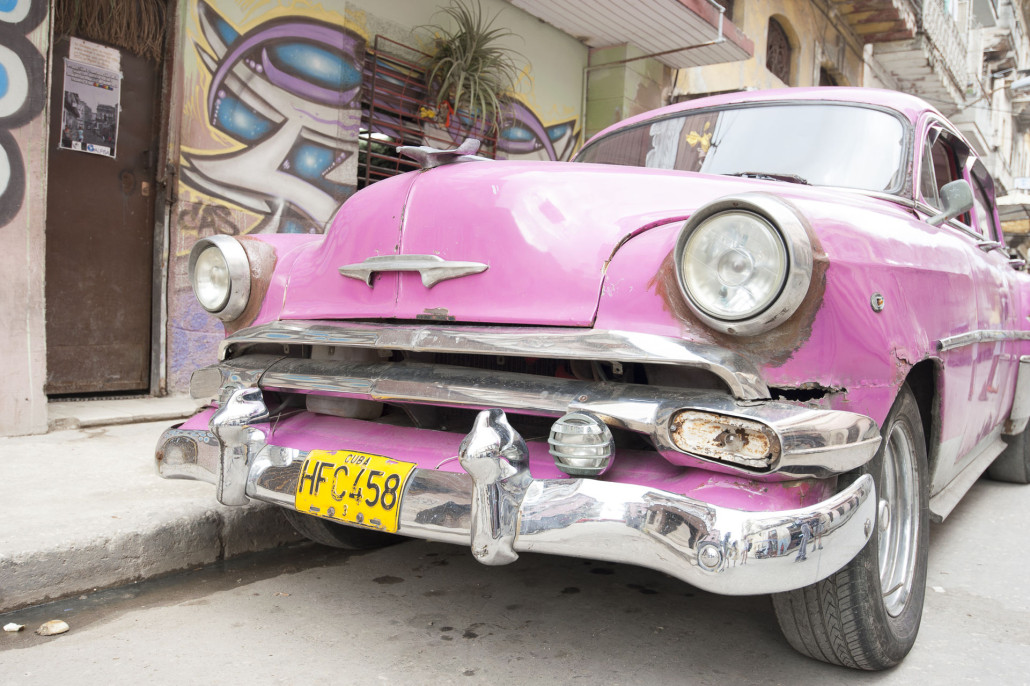 Classic car collectors are among those who are anxious for the export restrictions to be lifted in Cuba. Shown here is a pink 1950s-vintage Chevrolet parked on a street in Cuba. Photo by MiltonPoint, licensed under the Creative Commons Attribution-Share Alike 4.0 International license.