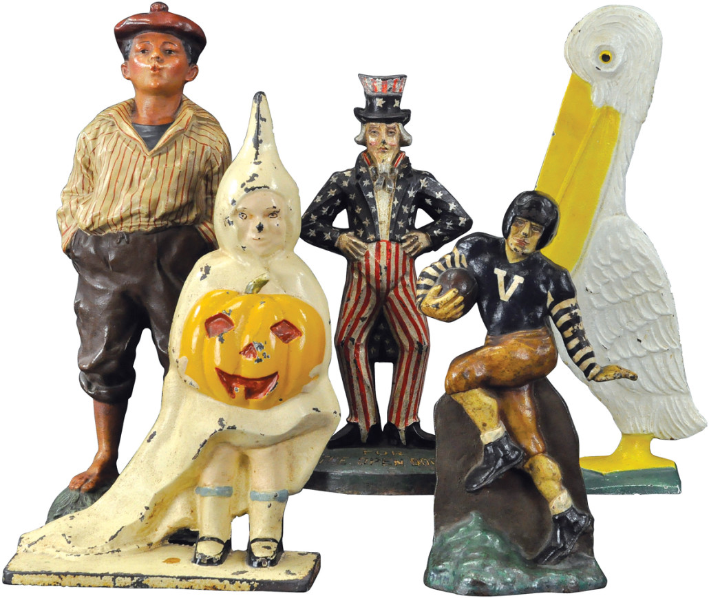 Five of the rare and beautiful figural cast-iron doorstops from the personal collection of Jeanne Bertoia, including (clockwise from rear left): Whistling Jim, Uncle Sam, Pelican, Football Player, and Halloween Girl
