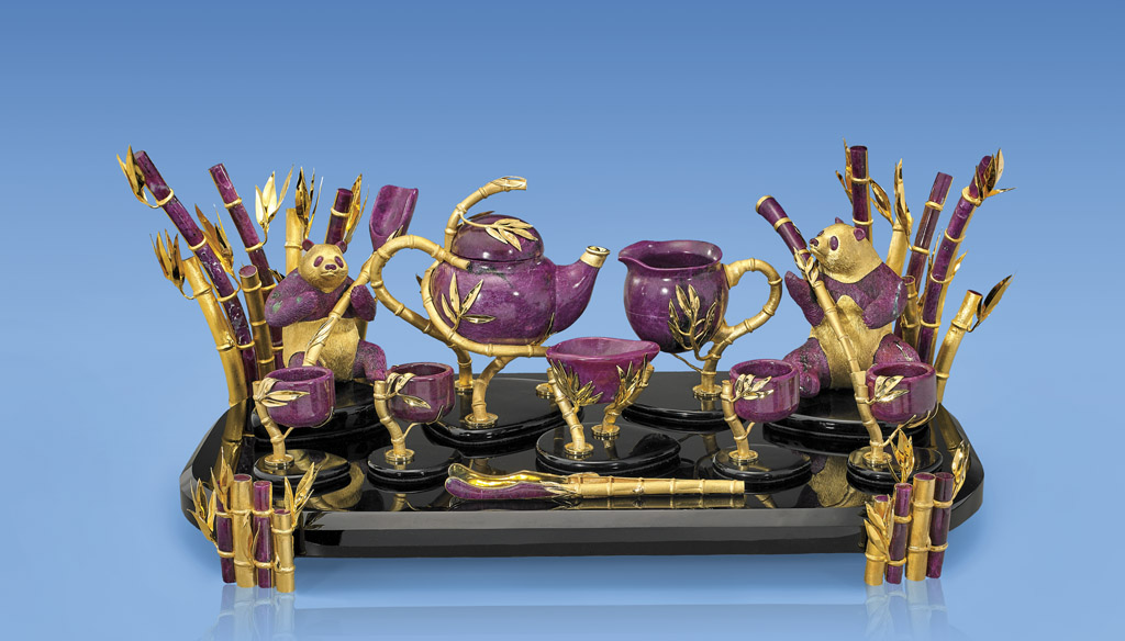 Monumental 13-piece ruby tea set with panda and bamboo motif, 18K gold vermeil mountings and accents, carved by Luis Alberto Quispe Aparicio. Est. $225,000-$275,000