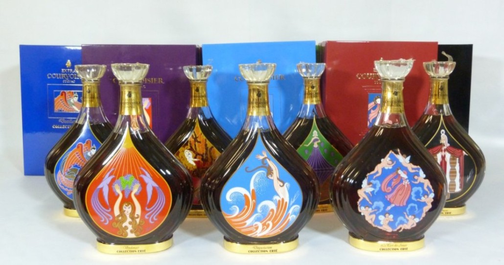 A collection of seven Erte Courvoisier Cognac bottles, unopened. The bottles were issued one per year and had a production run of 12,000. Antiques & Modern Auction Gallery image