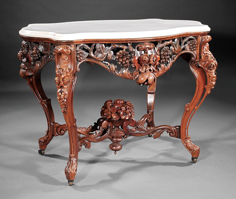 This American Rococo rosewood center table attributed to John Henry Belter sold for $57,950. Neal Auction Co. image