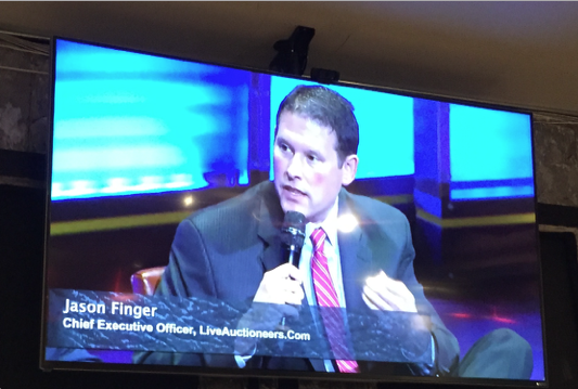 Image of Jason Finger, CEO of LiveAuctioneers.com, projected on a screen during the webcast of the April 4, 2016 National Geographic summit in Washington, D.C. Photo by Rohan Parikh