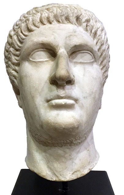An oversized Roman Imperial marble portrait head, Neronian–Flavian Period, circa mid to late first century, most likely of the Emperor Nero with a partial ancient recut to more closely resemble the Emperor Otho. While portraits of Nero are rare those of the short-lived Otho, who ruled for only three months, are rarer still. Estimate: $50,000-$75,000. Ancient Resource LLC image