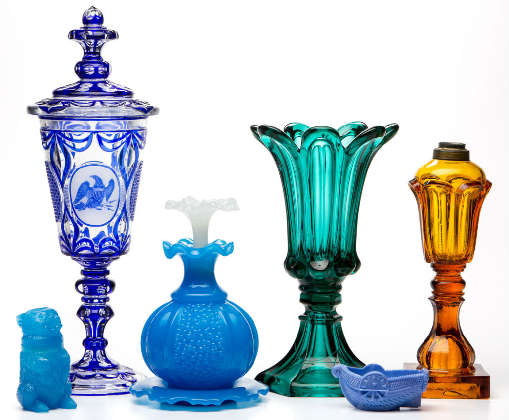 Sample of a wide variety of glass including an exceptional cut-overlay Bohemian covered pokal (second from left) made for the American market and decorated with a shield-breast eagle and Miss Liberty. Jeffrey S. Evans & Associates 