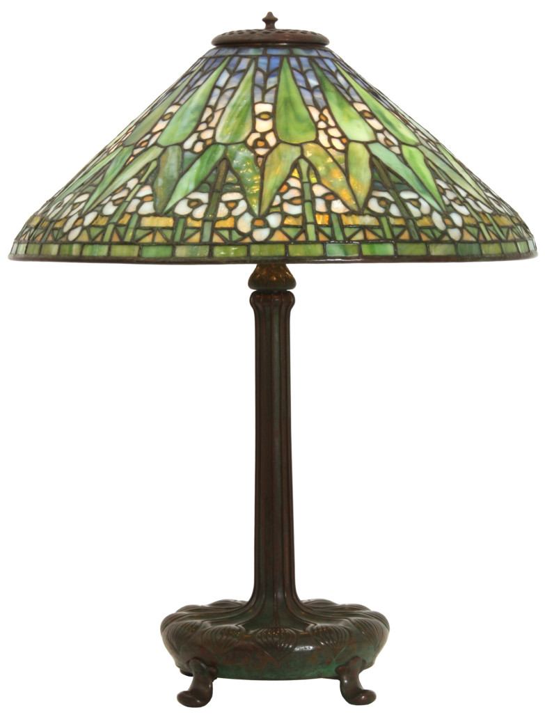 Tiffany Studios Arrowroot table lamp with a signed 20-inch diameter conical shade having gorgeous flower decorations. Estimate: $35,000-$40,000.
