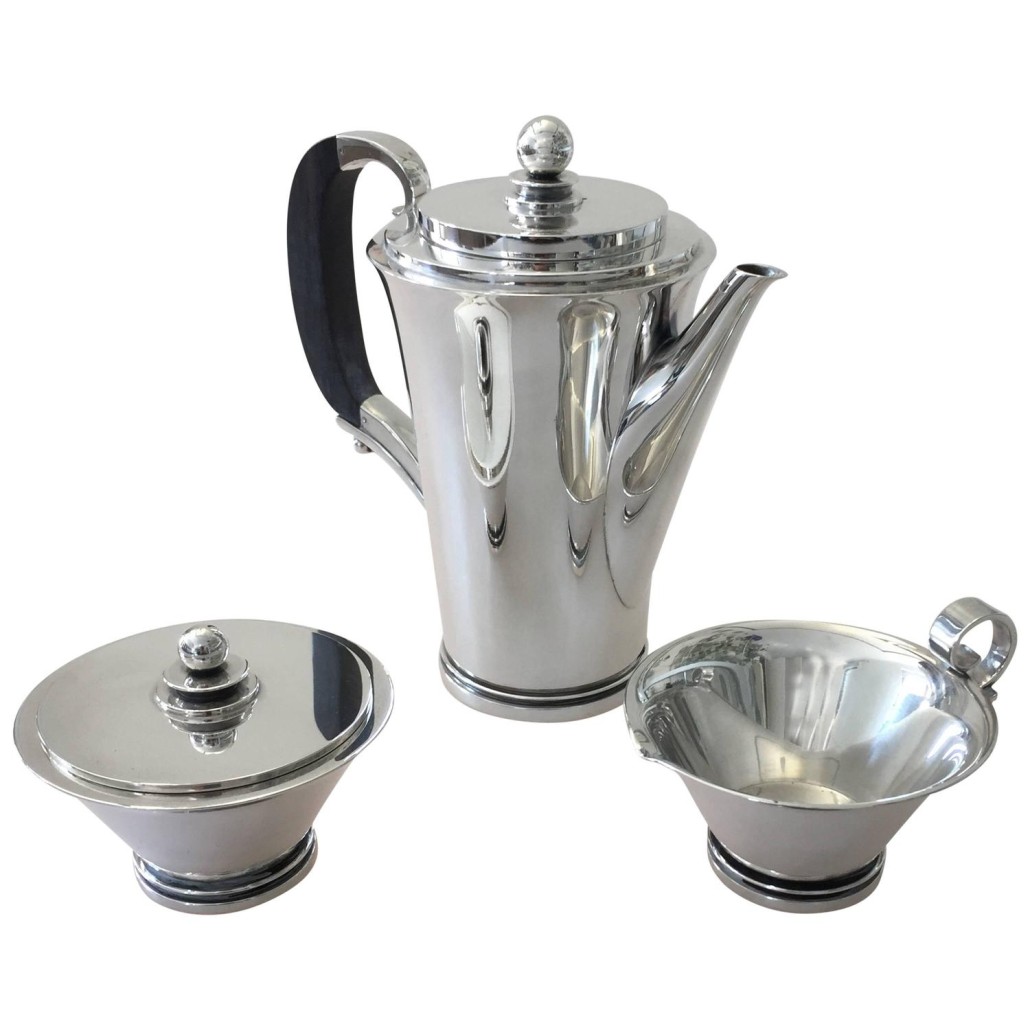 Georg Jensen sterling silver Pyramid pattern coffee set 600A. Four-piece set designed by Harald Nielsen in 1930. Sterling silver tray 1074 designed by Henning Koppel for Georg Jensen. Estimate: $8,000-$10,000. Chance by LiveAuctioneers image