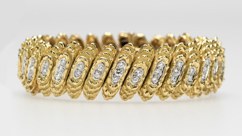 This Cartier diamond and gold textured link bracelet was estimated to bring $2,500 to $3,500, and exceeded expectations with an $11,250 online selling price. John Moran Auctioneers image