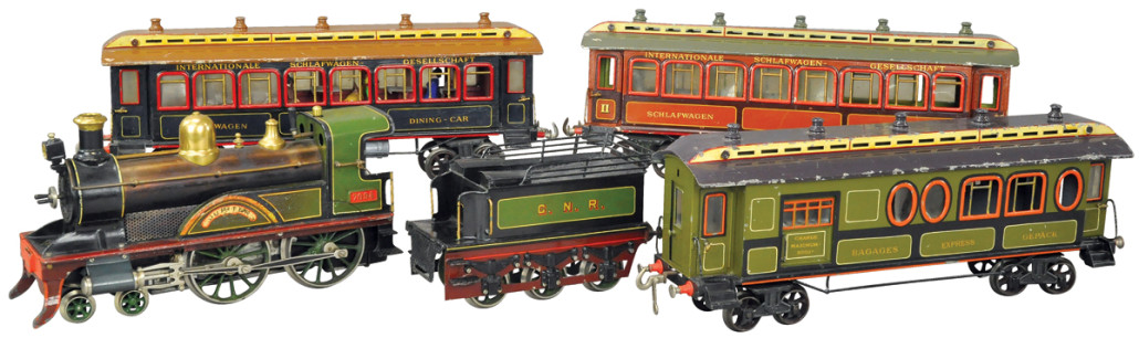Bing ‘Jupitor’ Gauge III passenger set features 4-4-0 live steam locomotive, original hand-enameled finish. Price realized: $48,000. 