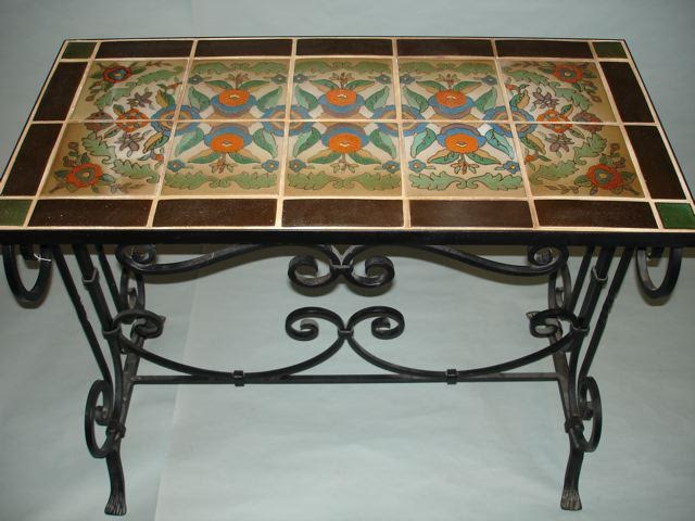 Wrought-iron table with top composed of 10 pottery tiles and additional border tiles, all by Taylor, est. $2,800-$3,850