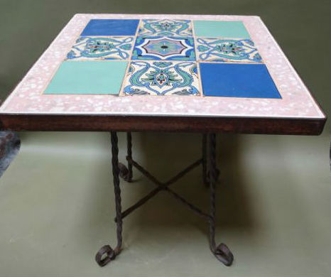 Dating to the early 1930s, this Catalina Island tabletop consists of nine tiles surrounded by a rare pink terrazzo frame. The 23-inch square tabletop is supported by a wrought iron base. Estimate: $2,800-$3,850. Early California Antiques image