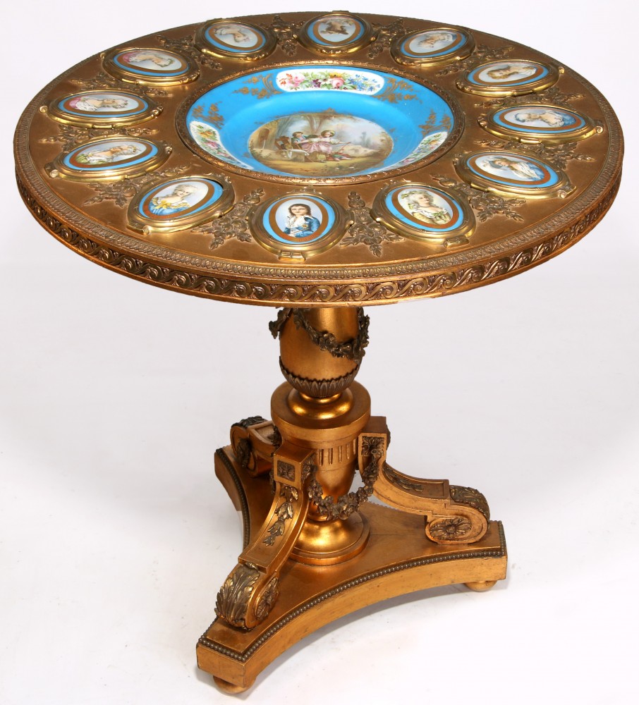 Circa 1900 Napoleon III-style gilded wood center table with ormolu mounts and Sevres-style porcelain plaques. Estimate: $5,000-$7,500. Dirk Soulis Auctions image