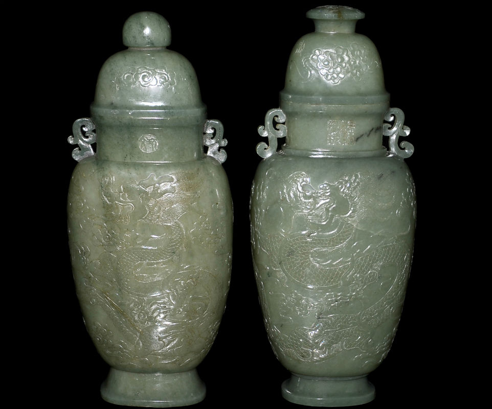 Celedon green jade Mughal style vases with covers. The tall baluster form vessels with ruyi handles are carved in low relief with dragon and phoenix amid scroll sprays. Estimate: $6,000-$8,000. Gianguan Auctions image
