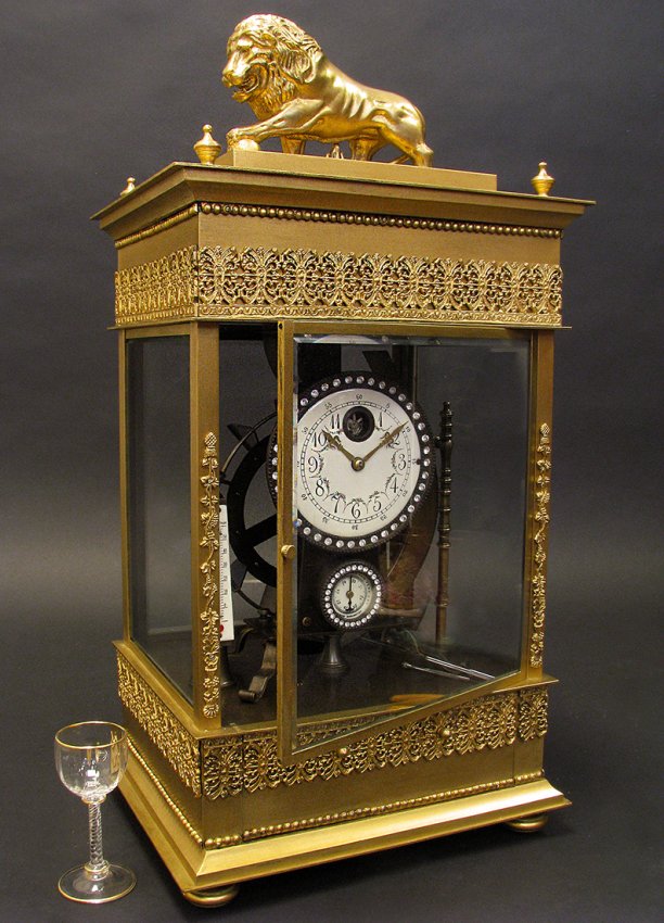 French gilt bronze mechanical falling ball mantel clock with barometer and thermometer, 23 inches high x 11 1/2 inches wide x 9 1/4 inches deep. Estimate: $8,000-$12,000. Royal Antiques image