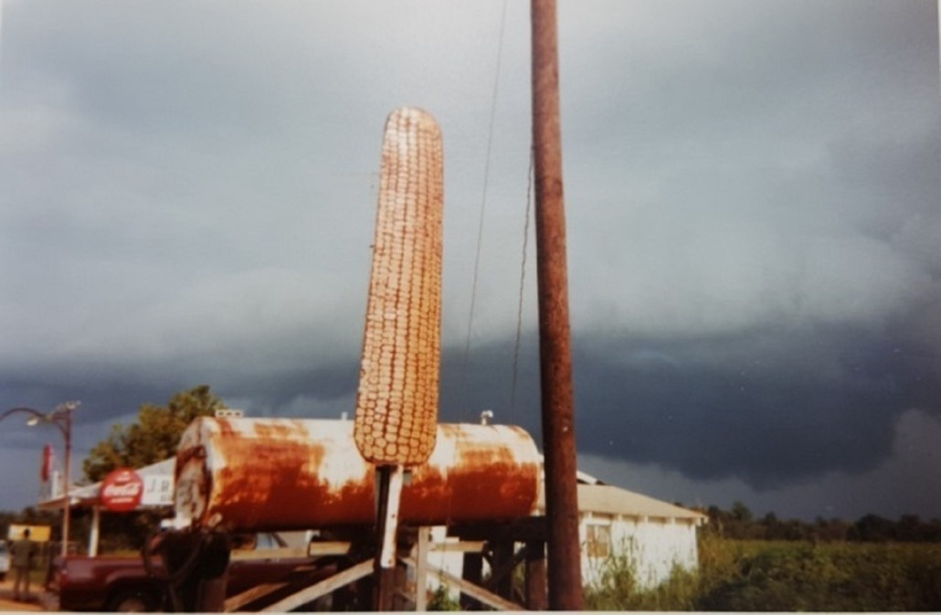 One of eight contemporary photographs by William Christenberry (American, b. 1936-), this one titled ‘Corn Sign with Storm Cloud, near Greensboro, Alabama, 1977,’ est. $3,000-$5,000. Waverly Rare Books image