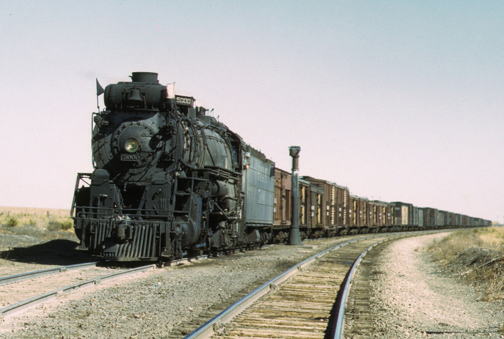 Atchison, Topeka & Santa Fe Railway 2-10-4 steam locomotive #5000 'Madame Queen' waiting in a siding to meet an eastbound train. Ricardo, New Mexico, March 1943. Image by Jack Delano, working for the U.S. Farm Security Administration - Office of War Information, courtesy of Wikimedia Commons