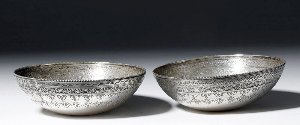 Afsharid silver bowls with intricately detailed floral and geometric motif, Persian Empire/Iran, 15th-18th century CE, est. $5,000-$7,000 the pair. Artemis Gallery image