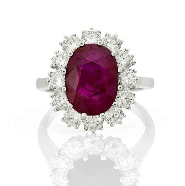Antique-style, 18K white gold ring, centering a fine faceted oval ruby of a deep gemmy red-violet color and weighing approx. 5.15 carats. Estimate: $25,000-$30,000. I.M. Chait image