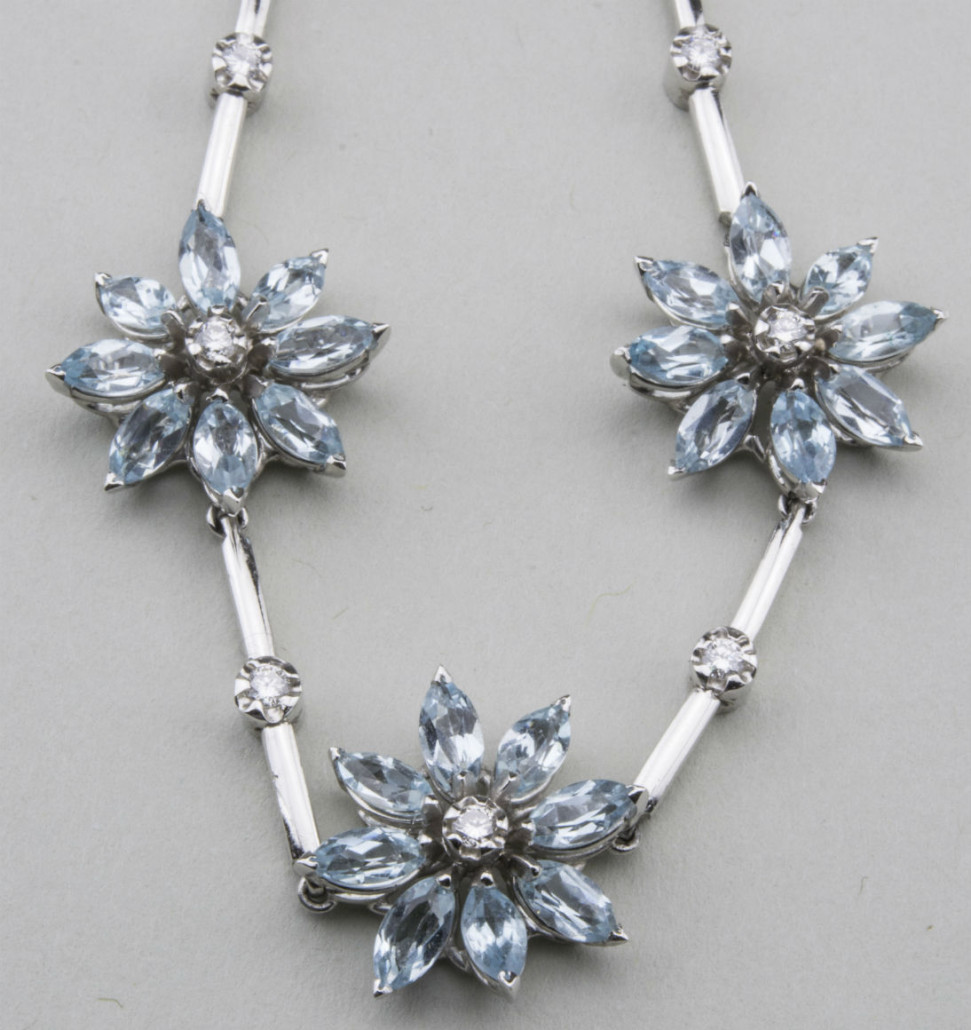 Asprey blue topaz and diamond Daisy Flower necklace, 18Kk white gold, 11 daisy flowers, part of a three-piece set, selling separately. Estimate: $5,000-$7,000. Capo Auction image