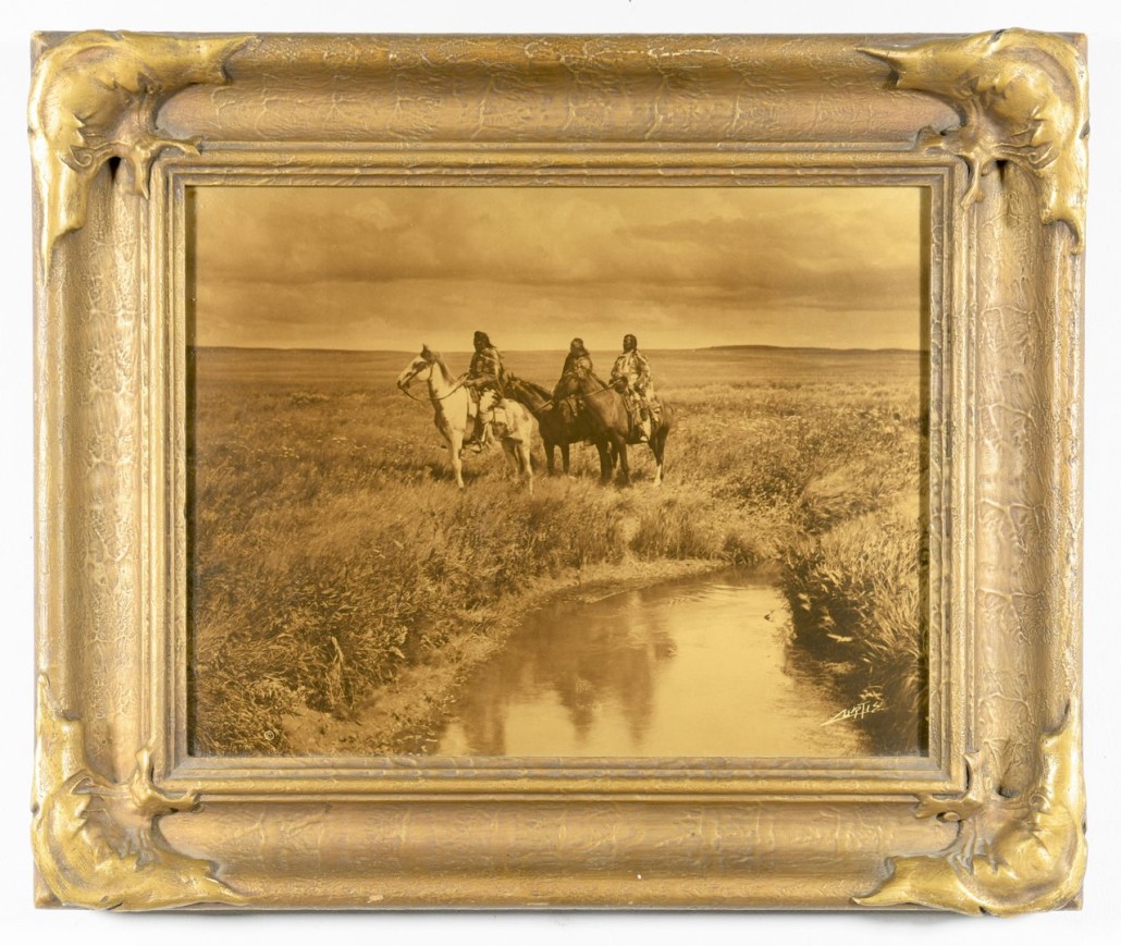 An Edward Curtis orotone, ‘The Three Chiefs,’ retains its original frame and broadside backing. Estimate: $6,000-$8,000. Case Antiques image