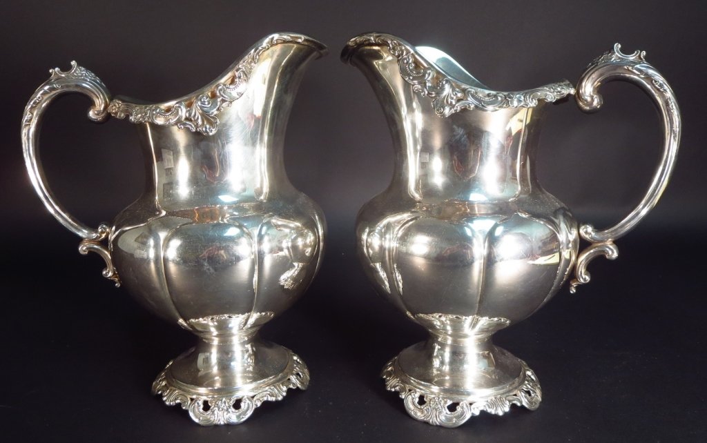 Sterling silver water pitchers by Wallace, 'Grande Baroque' pattern. Price realized: $2,500. Litchfield County Auctions image