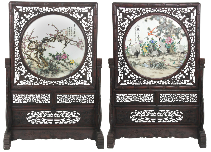 Pair of large Chinese teak and porcelain floor screens, having a profusely decorated 31-inch diameter porcelain center panel (est. $80,000-$120,000). Fontaine's Auction Gallery image