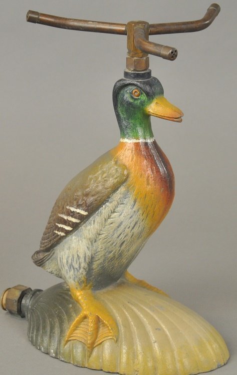 Bradley & Hubbard cast iron figural sprinkler depicts realistic mallard duck in standing position on half shell. Sold for $4,000