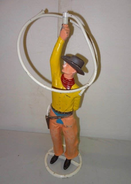 Western cowboy sprinkler made of cast aluminum and glass. Sold for $600