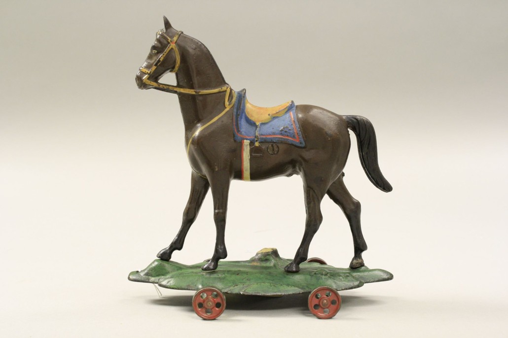 Large Ives Saddle Horse on Wheeled Base still bank, only known example, est. $25,000-$35,000 