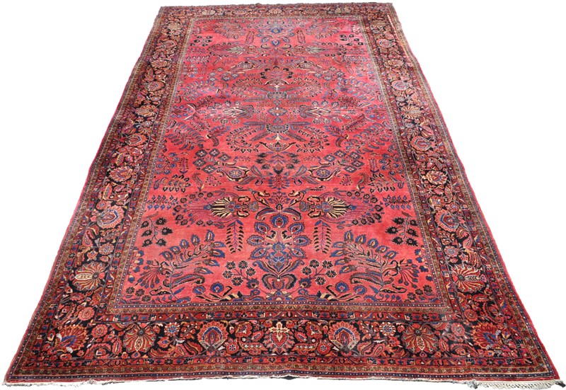 Room-size traditional Sarouk rug, approximately 18 by 13 feet, circa 190. Estimate: $2,000-$3,000. Charleston Estate Auctions image