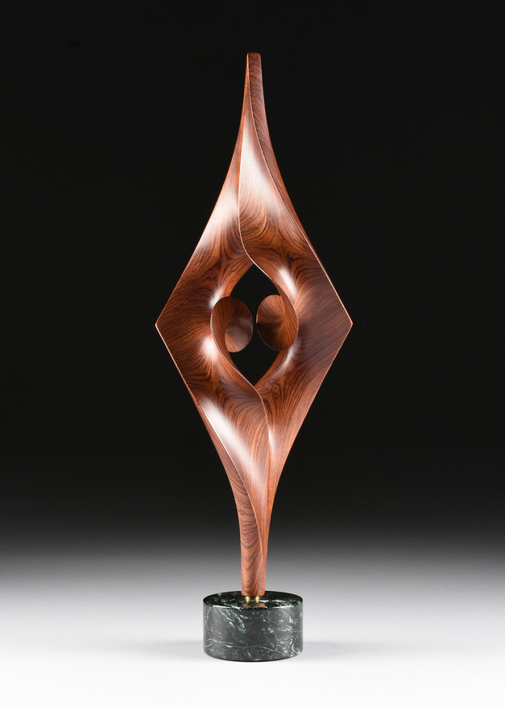 Robert Longhurst (American b.1949) a carved bubinga wood sculpture, 'Arabesque XLVI,' signed in the wood, (C), dated 2006, 22 inches high. Price realized $3,875. Simpson Galleries image