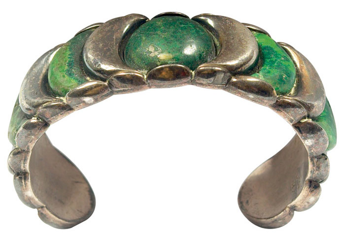 Large silver bracelet with malachite stones, marked Spratling Made in Mexico. Courtesy Treadway Gallery.