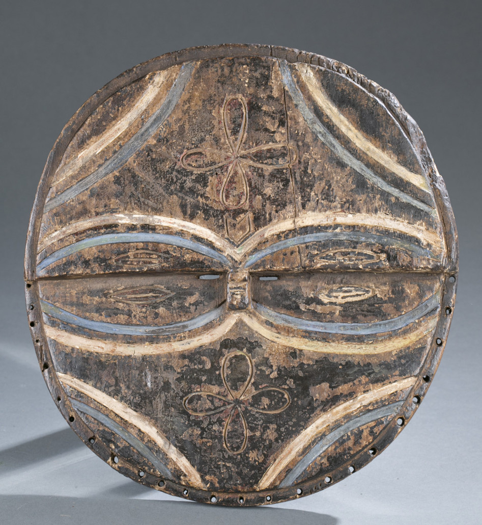 Wood mask with oval eyes outlined in blue pigment, Democratic Republic of the Congo, Teke, late 19th/early 20th century, est. $10,000-$15,000