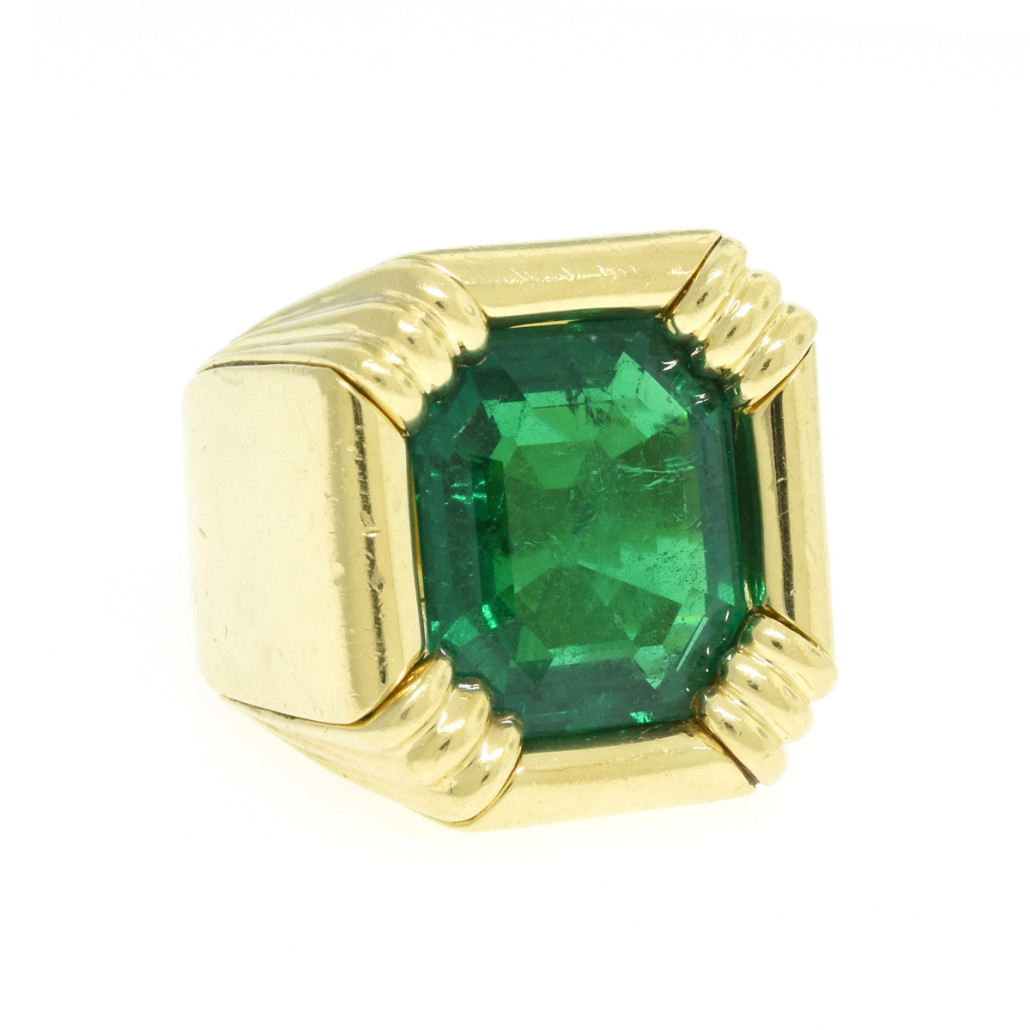 An emerald Henry Dunay ring, the 14k yellow gold mounting signed 'Dunay.' Price realized: $100,000. Simpson Galleries image