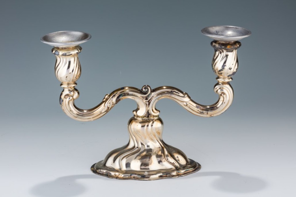 Silver Sabbath candleholder, Germany, circa. 1910, brought to America by Rebbetzin Pesse ‘Paula’ Carlebach when she immigrated in 1938. Marked 835, crown and moon. Estimate $3,000–$5,000. J. Greenstein & Co. image