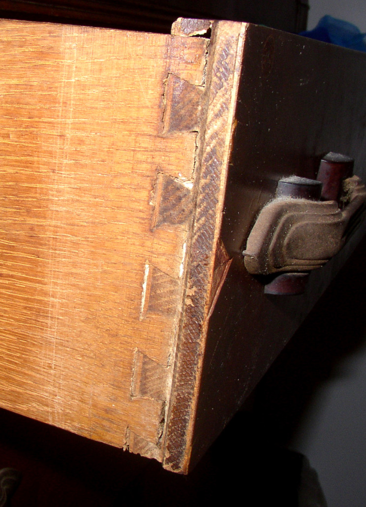 The uniform size and distribution of the pins and tails of this machine made dovetail joint from the 1930s varies dramatically from the large single tail and two small pins of the 17th century dovetail joint. But the principle, purpose and results are the same.