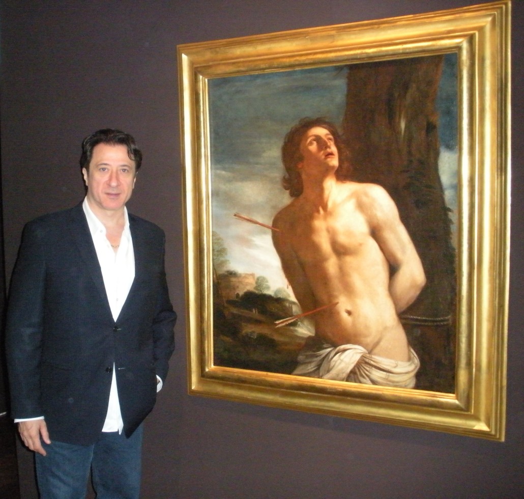 Federico Castelluccio with his Guercino painting of St. Sebastian. Photo by James Sliman