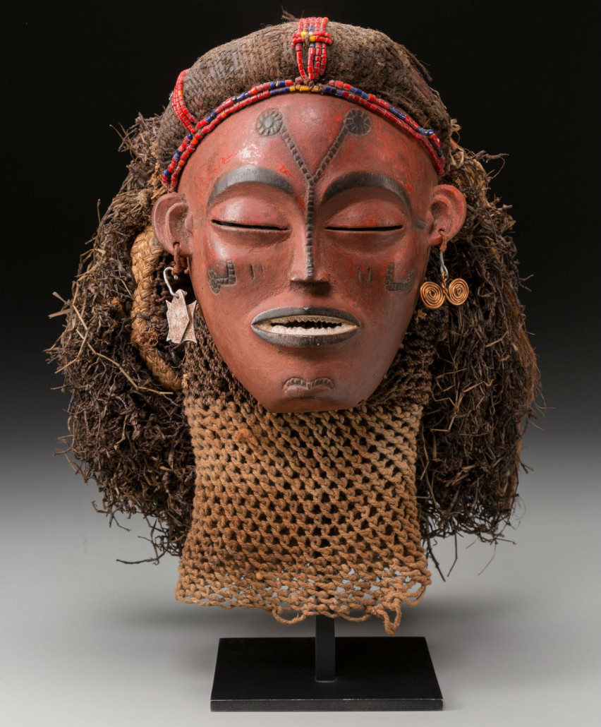 Pwo female mask. Chokwe, Angola. Wood, pigments, fibers, glass beads and metals. Estimate: $15,000-$25,000. Heritage Auctions image