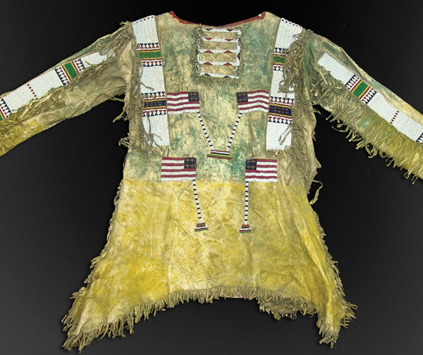 Late 1800s sinew sewn hide Sioux war shirt with lazy stitched beaded geometrics, arm and shoulder strips and several American flags. Price realized: $27,500 (prices do not include buyer’s primium). Allard Auctions Inc. image