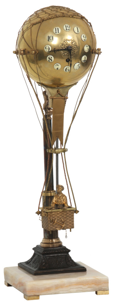 French industrial mystery swinger clock in the form of a hot air balloon, with a figure of a man in a wicker basket retrieving an anchor. Price realized: $14,520. Fontaine’s Auction Gallery image