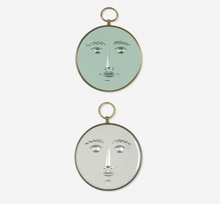 Fascinated by faces, the designer set them on a pair of brass-bound mirrors, circa 1950. One bears the identifying label ‘Fornasetti Milano Made in Italy.’ Courtesy Wright Auctions