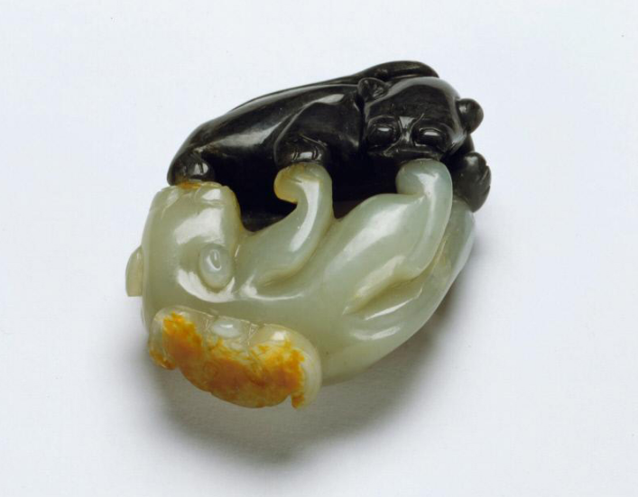 Variations in color on a piece of nephrite jade often inspired craftsmen; this unusual stone became light and dark cats playing while a rust-colored bat flutters at one end. The Qing dynasty sculpture is one example from a large collection formed by Avery Brundage (1887-1975), which became the foundation of the Asian Art Museum in San Francisco. Courtesy: Asian Art Museum