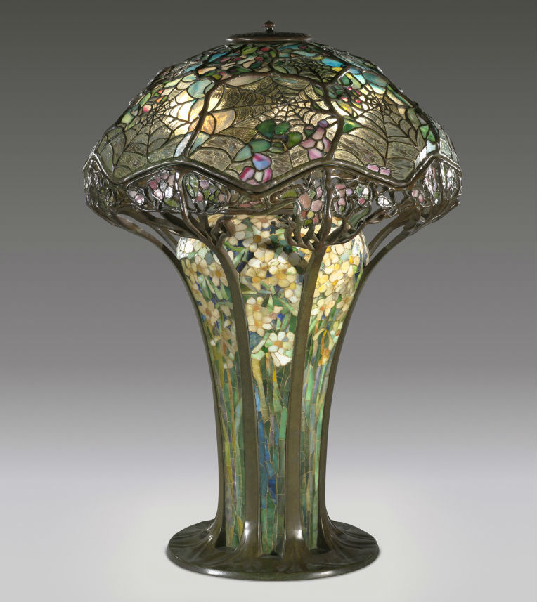 Introduced around 1900, the Cobweb or Spiderweb lamp was one of Tiffany’s most intricate designs. The broad mosaic-decorated base originally held combustible fuel while later examples were illuminated with three electric lightbulbs. Difficult to produce and expensive to purchase when made – a steep $500 – the design is at the top of any collector’s wish list. Courtesy of the Virginia Museum of Fine Arts