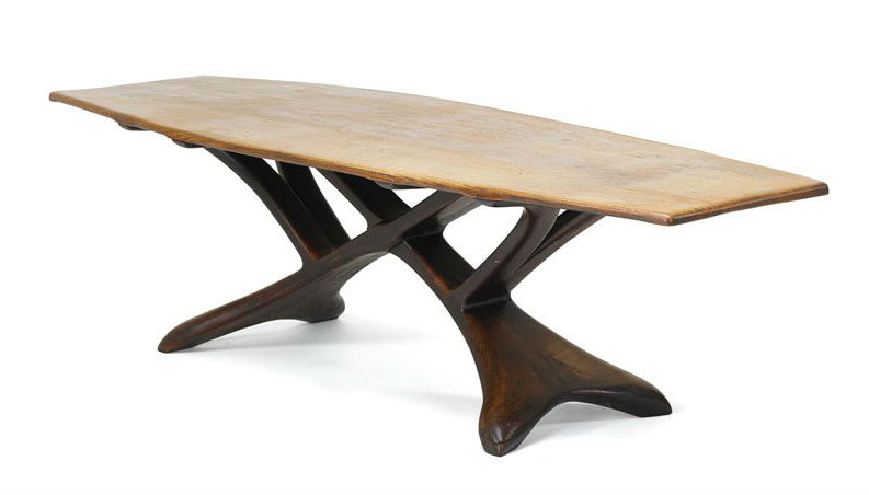 Wharton Esherick (1887-1970) dining table with reticulated base, Paoli, Pa., 1935, oak and carved walnut, 29 1/2 x 107 x 38 1/2 inches. Price realized: $200,000. Rago Arts and Auction Center image 