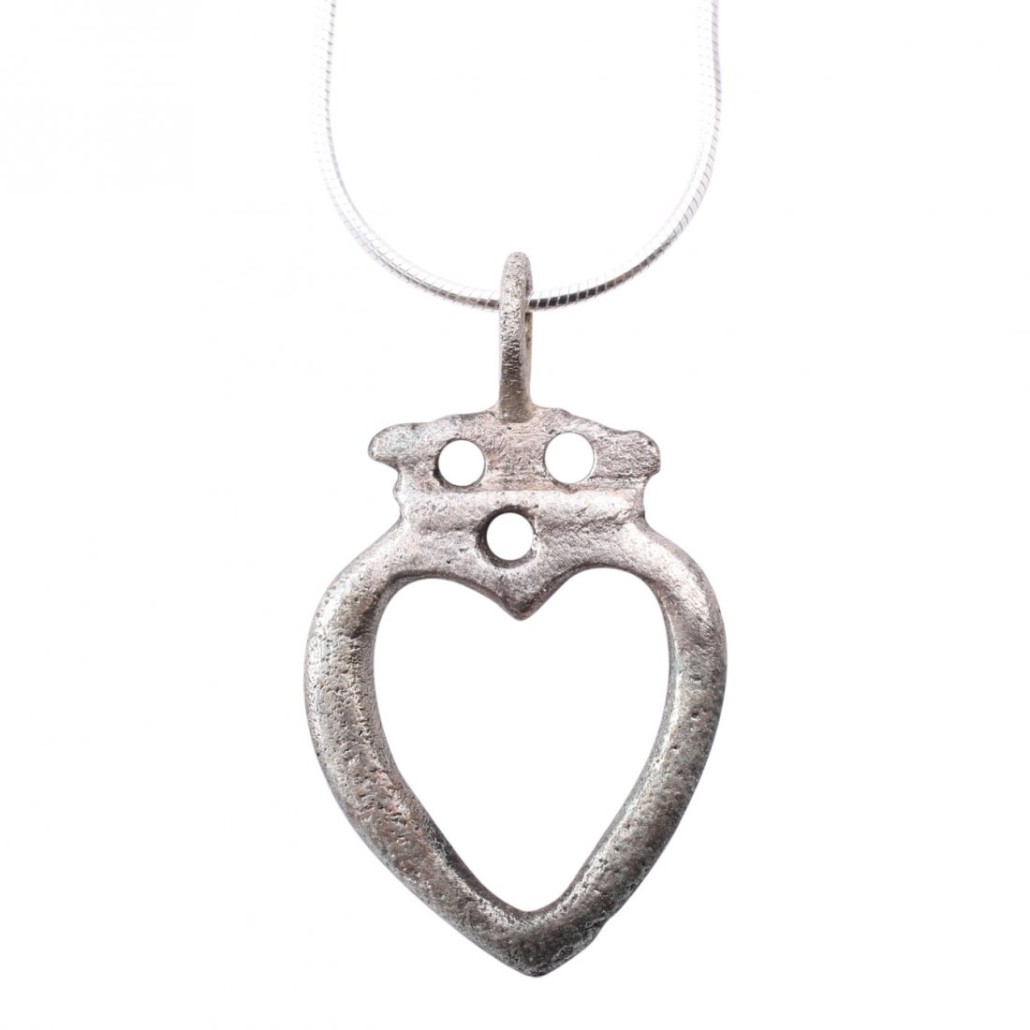 The heart had special meaning for Viking warriors as a male symbol for bravery, fortitude, loyalty, integrity. Viking crowned heart pendant, silver overlay, A.D. 900-1050, 1 3/16 inches. Estimate: $230-$300. Jasper52 image