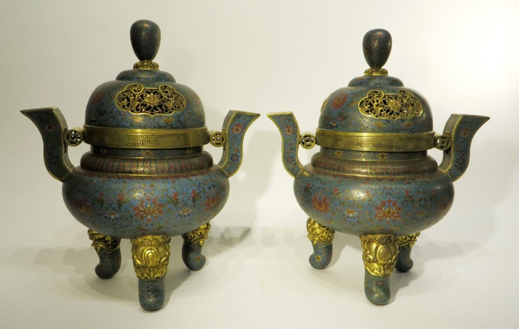 Monumental pair of Chinese cloisonné covered tripod censers with a design of lotus blossoms and tendrils, each 15 1/2 inches tall. Estimate: $8,000-$12,000. Converse Auctions image