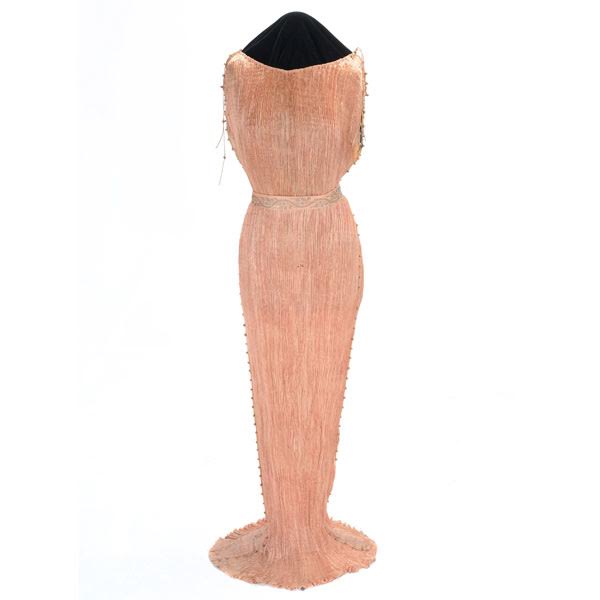Mariano Fortuny Delphos dress in salmon pleated silk, estimate $1,500-$2,000